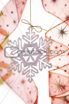 Christmas decoration with snowflake and ribbons