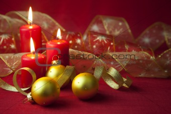 Christmas decoration with candles and ribbons