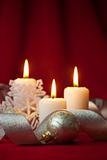 Christmas decoration with candles and ribbons