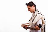 Side view of young  jewish man with book