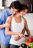 Romantic couple enjoying their love in kitchen