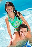 Father With Daughter On His Shoulders In Swimming Pool