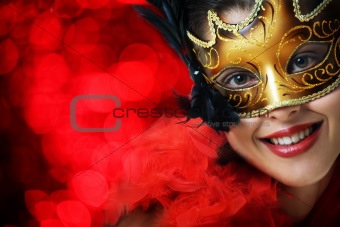 Beautiful young woman in carnival mask