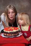 mother and son with birthday cake