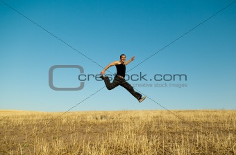 Young handsome asian man jumping