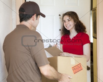 Young Woman Signs for Delivery