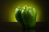 Green sweet pepper on yellow-green background