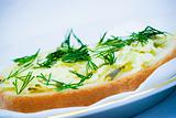 Sandwich with cheese, salted cucumber and dill