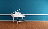 white gran piano in blue interior