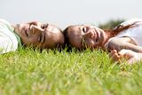 Young couple relaxing on a lawn