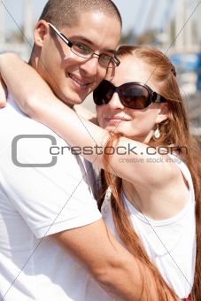 Close up portrait of a happy couple hugging 
