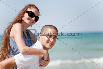 Young man piggyback his girlfriend