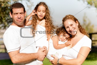 Caucasian happy family in the park