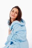 attractive brunette in blue bathrobe with hood isolated on white
