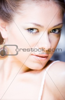 closeup portrait of attractive young woman with mysterious look