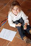 little girl drawing a house