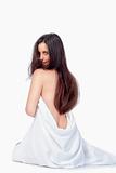 brunette with long hair in white towel isolated on white background