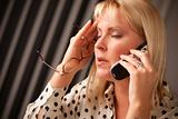 Blonde Woman on Her Cell Phone with Stressed Look on Her Face.