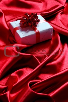 gift box on red satin background