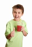 Healthy boy drinking juice thumbs up