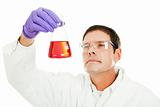 Scientist Examines Liquid Compound