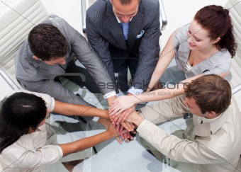 Close-up of business team with hands together. Teamwork