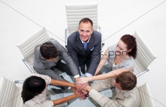 Smiling manager holding his colleagues' hands