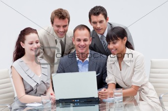 Business team working with a laptop in an office