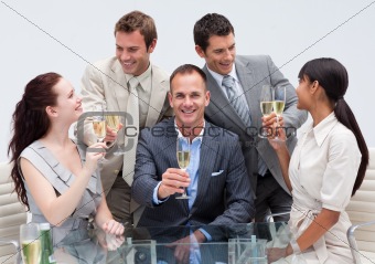 Business team toasting with champagne in the office