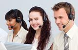 Beautiful woman working with her team in a call center