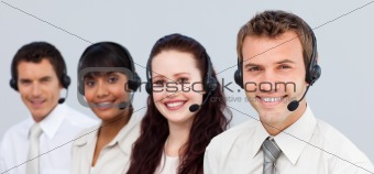 Young multi-ethnic business team working with computers in an office