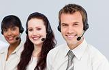 Young team with a headset on working in a call center