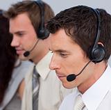 Portrait of an attractive man working in a call center