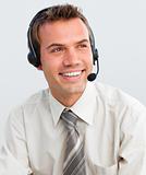 Attractive young businessman with a headset on