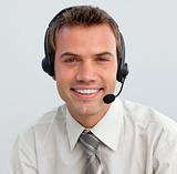 Portrait of a smiling businessman with a headset on