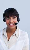 Beautiful ethnic businesswoman working in a call center