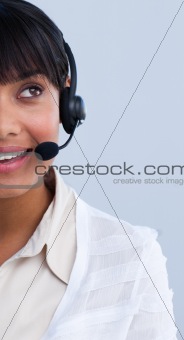 Close-up of an attractive ethnic businesswoman in a call center