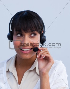 Attractive ethnic businesswoman working in a call center
