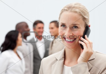 Beautiful businesswoman on phone in workplace