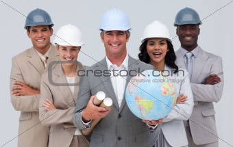 Enginner team holding a terrestrial globe