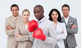 Afro-American businessman boxing and  leading his team