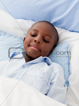 Little boy sick in bed