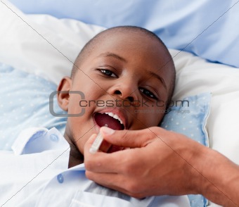 Small Boy sick in bed