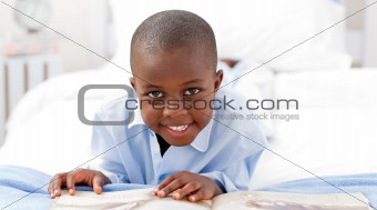 Small boy reading a book