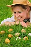 Young woman and easter eggs on the grass - Easter time