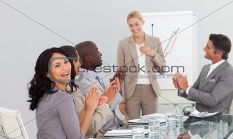 Business team applauding in a meeting