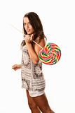 Pretty young Hispanic woman with lollipop