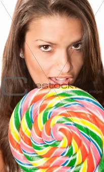 Pretty young Hispanic woman with lollipop
