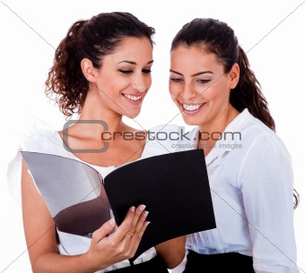 Young business colleagues looking at the files