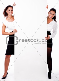 Full length of a young business colleague standing with blank wh